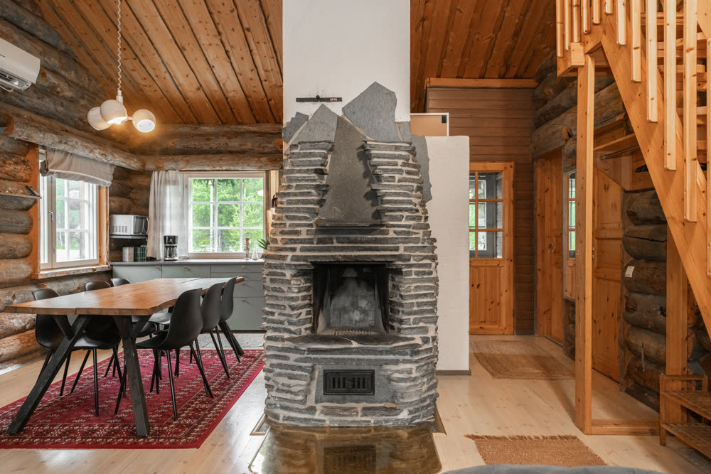 Stone fireplace beside the dining area