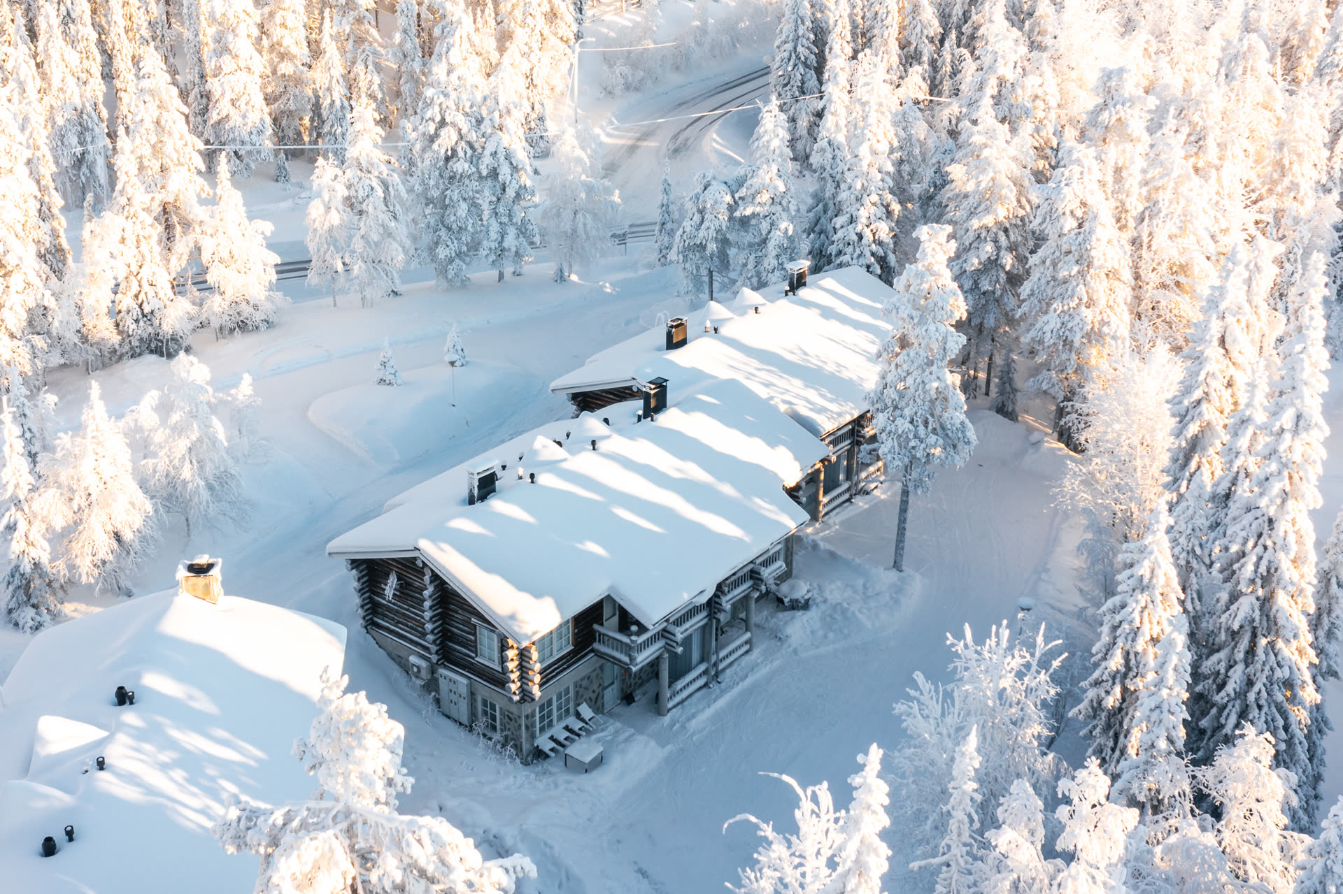 Aerial view of the East Ruka forest with Lumiaava's cabin cluster among the pines